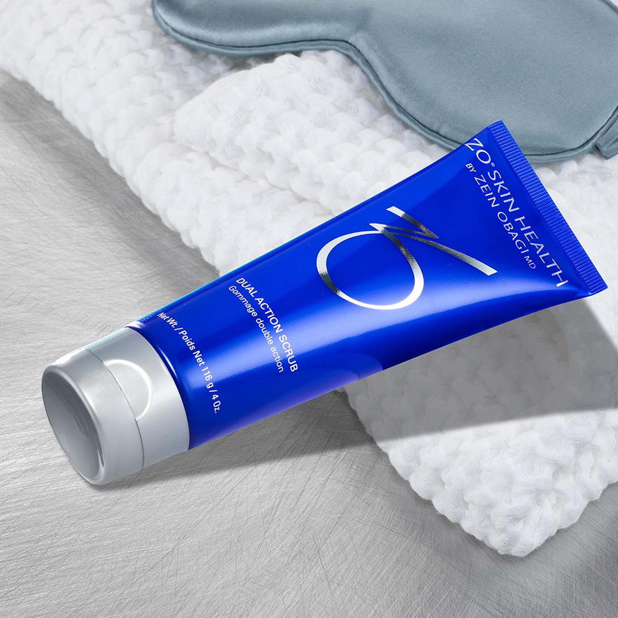 ZO SKIN HEALTH Dual Action Scrub jar label—gently buffs away dead skin for smoother texture.